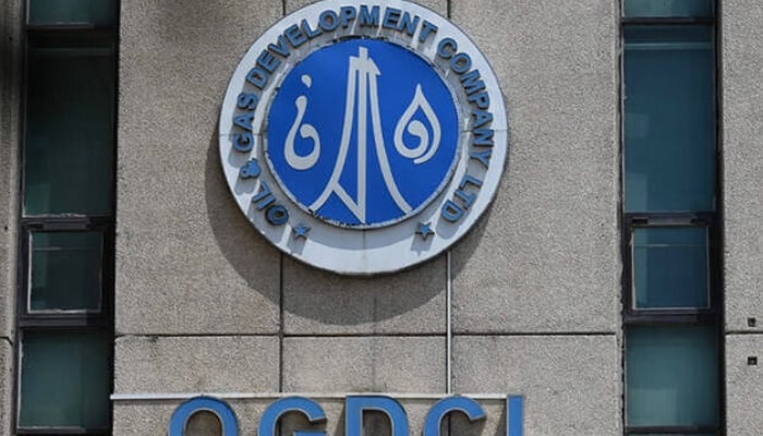 The logo of the Oil and Gas Development Company (OGDCL) is pictured at the facade of their headquarters in Islamabad. — AFP/File