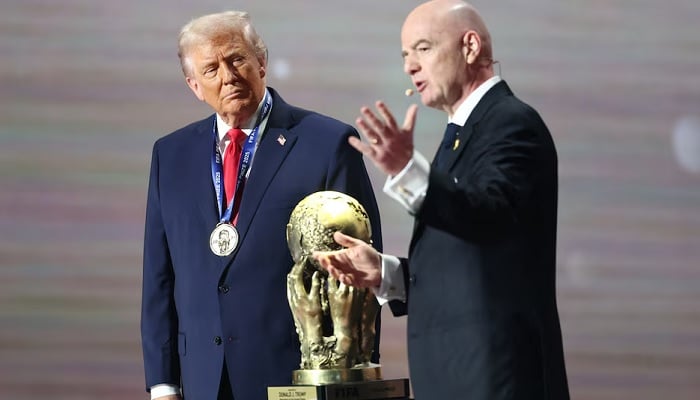 FIFA President Gianni Infantino presents US President Donald Trump with the FIFA Peace Prize during the World Cup 2026 final draw at the Kennedy Centre in Washington, DC, US, on Dec 5, 2025. — Reuters