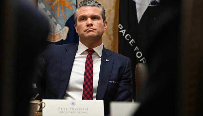 US Secretary of Defense Pete Hegseth looks on during a Cabinet Meeting hosted by President Donald Trump in the Cabinet Room of the White House in Washington, DC on December 2, 2025. — AFP
