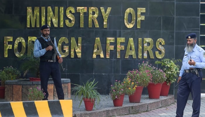 Pakistani policemen stand guard outside the Foreign Ministry building in Islamabad. — AFP/File