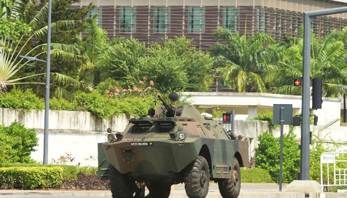 A military armoured vehicle takes position, in front of the headquarters of Benins radio and television station, after, according to Benins Interior Minister, the countrys armed forces thwarted the attempted coup against the government of Benins President Patrice Talon, in Cotonou, Benin, December 7, 2025. — Reuters