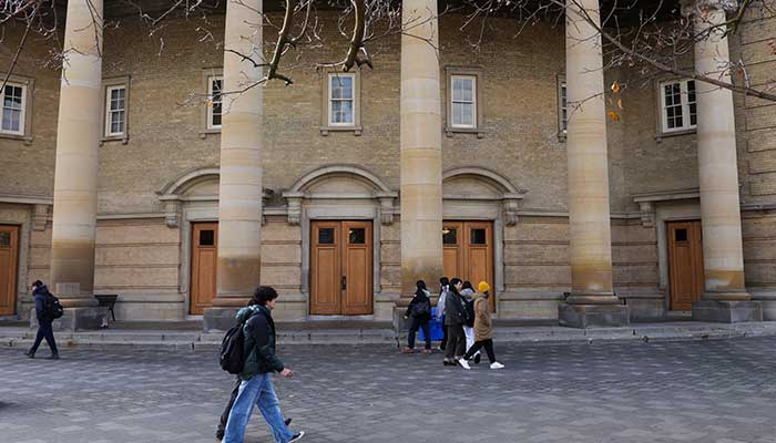 Students walk at the St. George campus of the University of Toronto, in Toronto, Canada, November 20, 2025. — Reuters