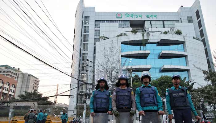 Policemen stand guard in front of the Bangladesh Election Commission office ahead of the expected general election schedule announcement in Dhaka, Bangladesh, December 11, 2025.— Reuters
