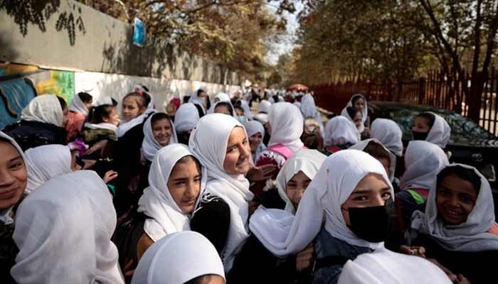 Female primary school students gather in the school street. — Reuters/File