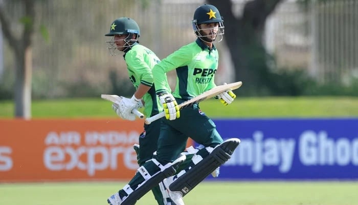 Pakistans Sameer Minhas (right) and Ahmed Hussain run between the wickets during their U19 Asia Cup match against Malaysia at The Sevens, Dubai, December 12, 2025. — X/@TheRealPCB