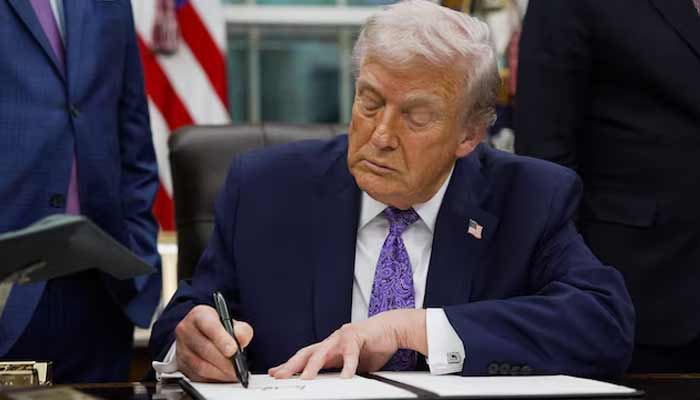US President Donald Trump signs an executive order on AI, in the Oval Office at the White House in Washington, DC, US, December 11, 2025. — Reuters
