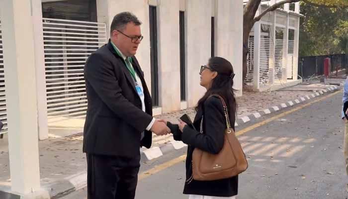 Norwegian Ambassador Per Albert Ilsaas meets lawyer Imaan Zainab outside the Supreme Court, Islamabad, December 11, 2025. — Screengrab via X