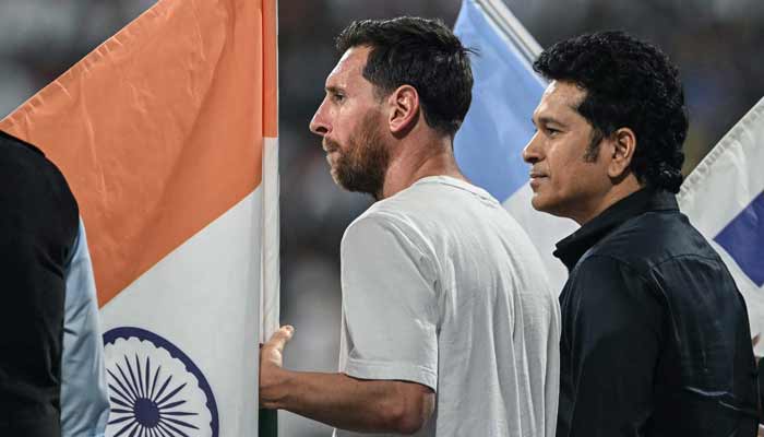 Argentinas footballer Lionel Messi (Left) and Indias former cricketer Sachin Tendulkar attend an event during Messis Goat Tour at the Wankhede Stadium in Mumbai on December 14, 2025. — AFP