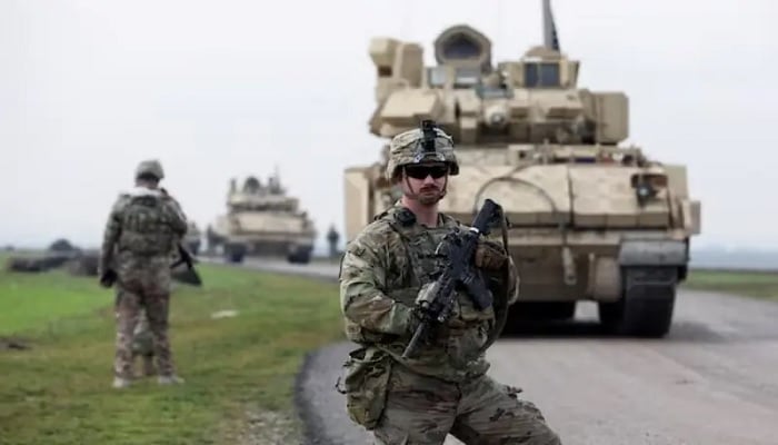 A soldier from the US-led coalition stands guard during a joint US-Kurdish-led Syrian Democratic Forces patrol in the countryside of Qamishli in northeastern Syria, February 8, 2024. — Reuters