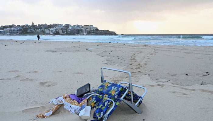 Items lie on the sand following the attack on a Jewish holiday celebration at Sydneys Bondi Beach, in Sydney, Australia, December 15, 2025. — Reuters