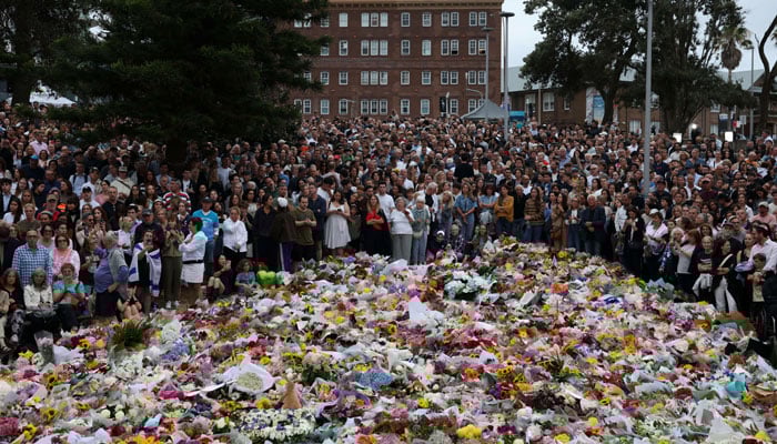 People lay flowers and pay tributes at Bondi Beach to honour the victims of a mass shooting that targeted a Jewish Holiday celebration on Sunday at Bondi Beach, in Sydney, Australia, December 16, 2025. — Reuters