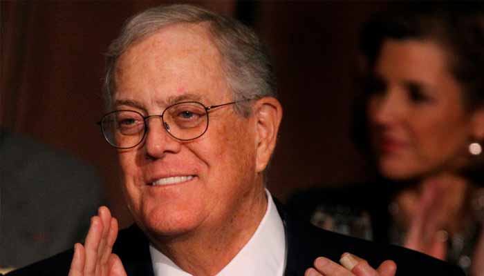 David Koch, executive vice president of Koch Industries, applauds during an Economic Club of New York event in New York, December 10, 2012. — Reuters