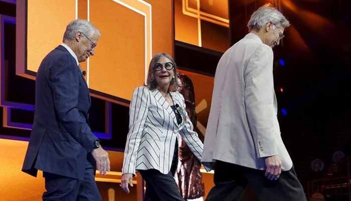 Walton family members (left to right) Rob, Alice and Jim Walton leave the stage after presenting an award at the Wal-Mart annual meeting in Fayetteville, Arkansas, June 5, 2015. — Reuters