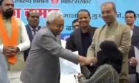 Indian CM removes Muslim woman's hijab during official event