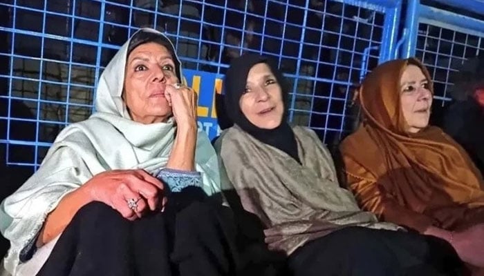 (From left to right) PTI founder Imran Khan’s sisters Aleema Khan, Uzma Khanum and Noreen Niazi stage sit-in outside Adiala jail on December 16, 2025. — Facebook/PTI Khyber Pakhtunkhwa