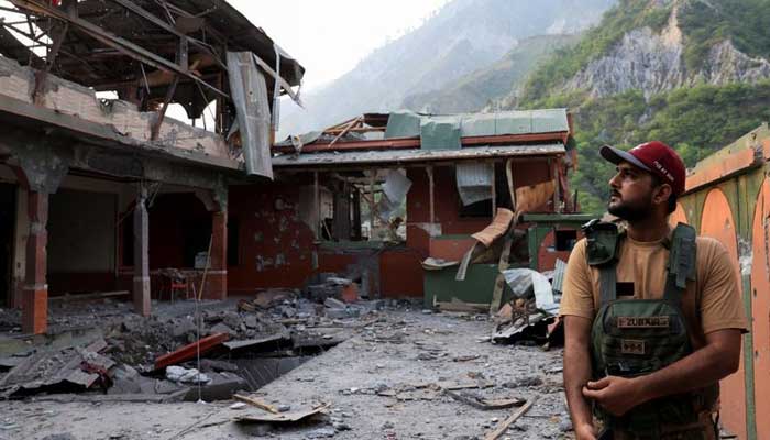 A Pakistan Army soldier stands at the premises of the Bilal Mosque, after it was hit by an Indian strike in Muzaffarabad, AJK on May 7, 2025. — Reuters