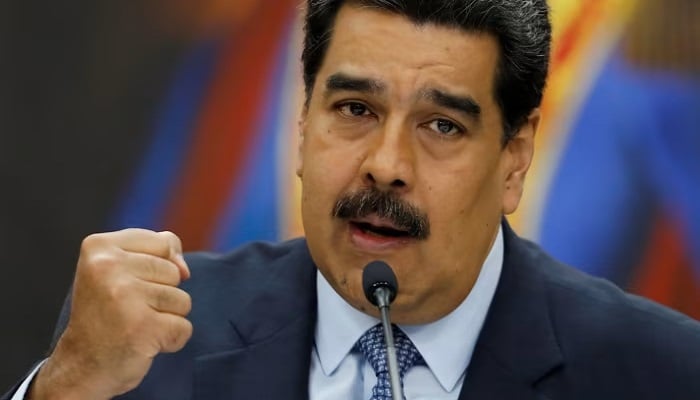 Venezuelan President Nicolás Maduro makes a fist while addressing an event in this undated photo. — Reuters/File