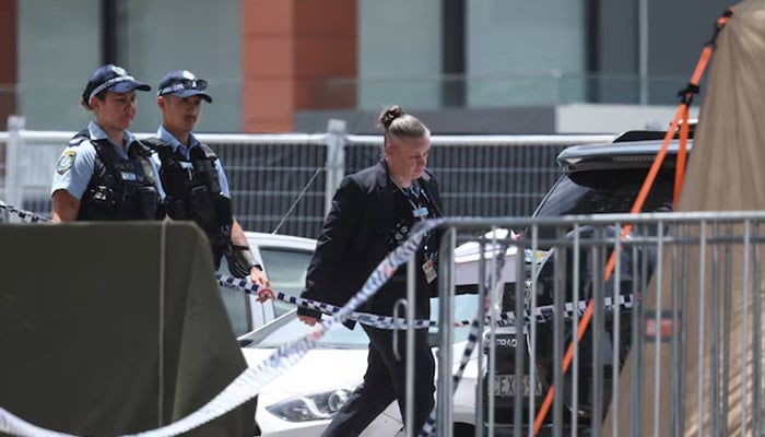 Police officers enter a tent at the scene of a shooting during a Jewish holiday celebration at Bondi Beach, in Sydney, Australia, December 15, 2025. — Reuters