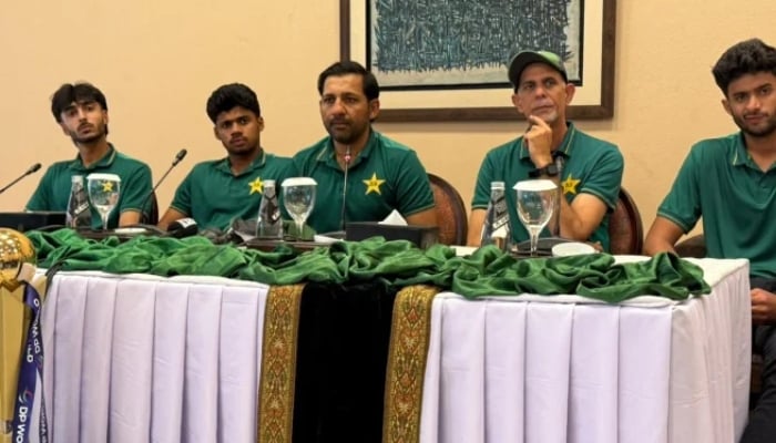 Pakistan U19 team mentor Sarfaraz Ahmed (centre), along with head coach Shahid Anwar (right) and team captain Farhan Yousuf (left), during a press conference in Islamabad on December 22, 2025. – PCB