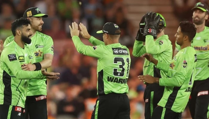 Sydney Thunders Shadab Khan celebrates taking the wicket of Brisbane Heats Matthew Renshaw during the BBL match at Manuka Oval, on December 22, 2025, Canberra, Australia. — AFP