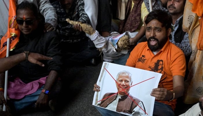BJP and religious activists with a poster of Bangladesh’s Muhammad Yunus shout slogans during a protest near the Deputy High Commission of Bangladesh in Kolkata, India, December 22, 2025. — AFP