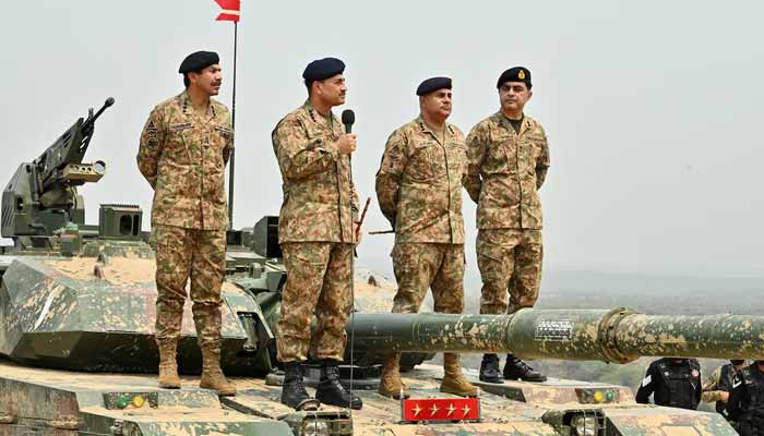 Chief of Army Staff and Chief of Defence Staff Field Marshal Asim Munir holds a microphone during his visit at the Tilla Field Firing Ranges (TFFR) to witness the Exercise Hammer Strike, in Mangla, May 1, 2025. — ISPR