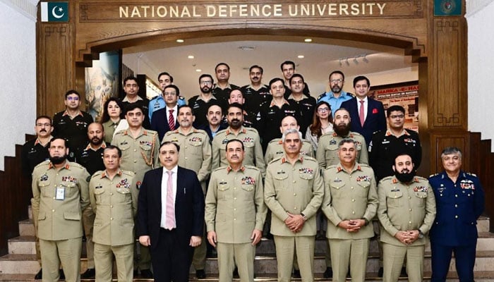 Field Marshal Syed Asim Munir, along with civil and military participants of the ongoing National Security and War Course, poses for a group photo on December 23, 2025. — ISPR