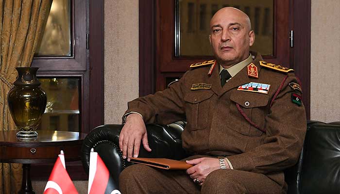 This handout photograph taken and released by the Turkiye Defence Ministry on December 23, 2025, shows Lybias Chief of the General Staff, General Muhammad Ali Ahmad al-Haddad posing posing during his meeting with Turkiyes Defence Minister in Ankara. — AFP