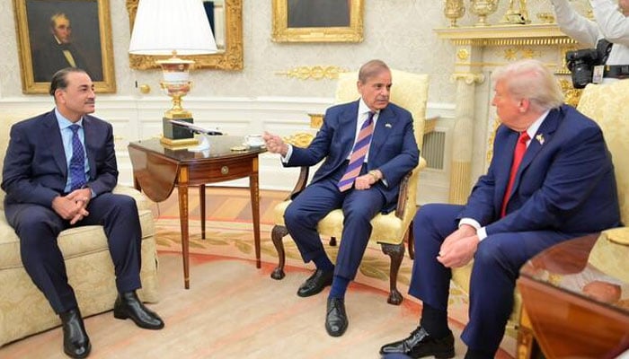 Prime Minister Shehbaz Sharif speaks during a meeting with US President Donald Trump, as Field Marshal Asim Munir gestures, at the Oval Office in Washington on September 25, 2025. —PMO