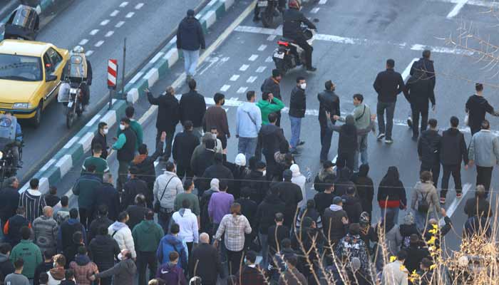 Shopkeepers and traders protest in the street against the economic conditions and Irans embattled currency in Tehran on December 29, 2025.— AFP