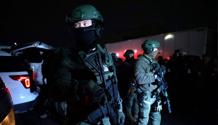 Armed police officers arrive at the Metropolitan Detention facility in the Brooklyn borough of New York, where ousted president Nicolas Maduro is expected to be held, on January 3, 2026 in New York City. — AFP