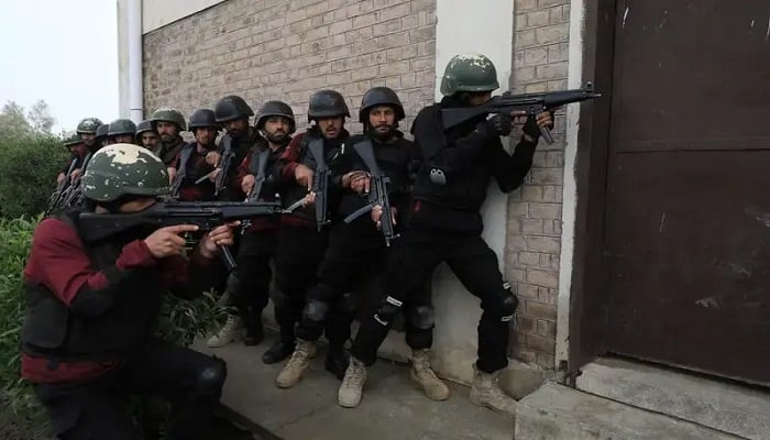 Police officers take position during a counterterrorism training session at the Elite Police Training Centre in Nowshera, Pakistan, February 10, 2023.— Reuters