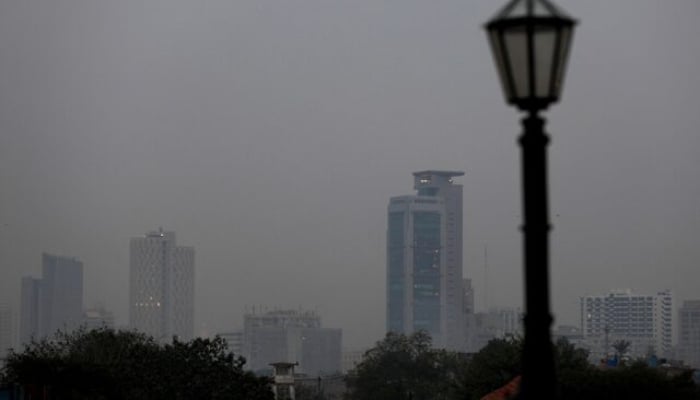 A general view of commercial banks amid haze during evening hours in Karachi, Pakistan, January 3, 2022. — Reuters