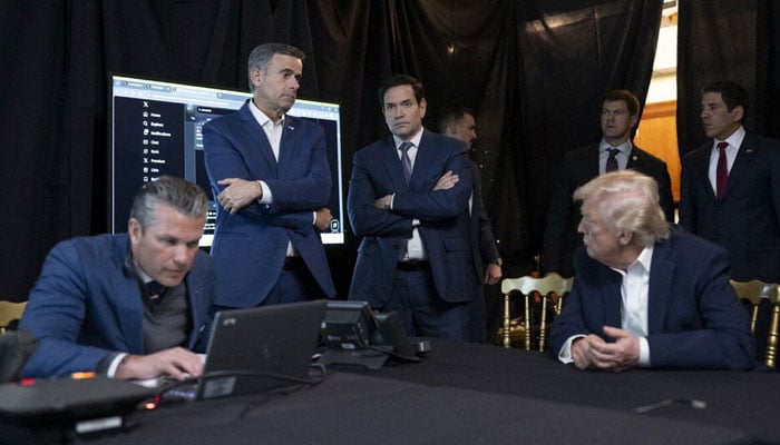A photograph posted by US President Donald Trump on his Truth Social account shows him sitting near US Secretary of Defense Pete Hegseth as CIA Director John Ratcliffe and Secretary of State Marco Rubio as they watch the US military operation in Venezuela on January 3, 2026. — Reuters