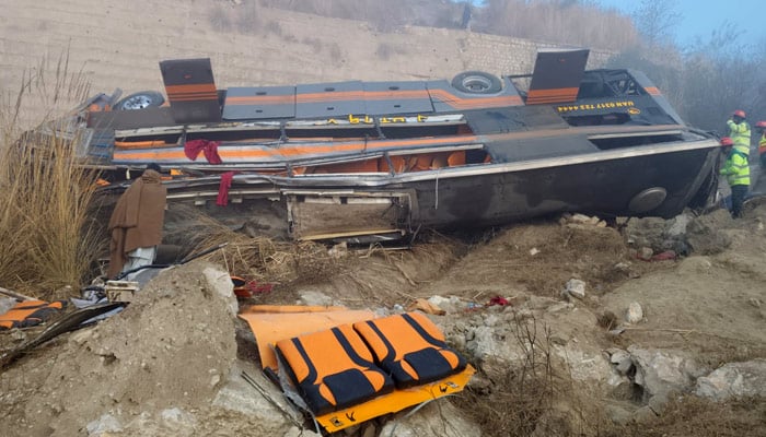 Rescue workers inspect an overturned vehicle after an accident near Talagang on January 7, 2026. — Reporter