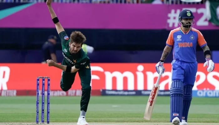 Pakistans Shaheen Shah Afridi (left) bowls a delivery with Indias Virat Kohli at the non-striker end during their ICC Mens T20 World Cup match at the Nassau County International Cricket Stadium in New York, US, June 9, 2025. — AFP