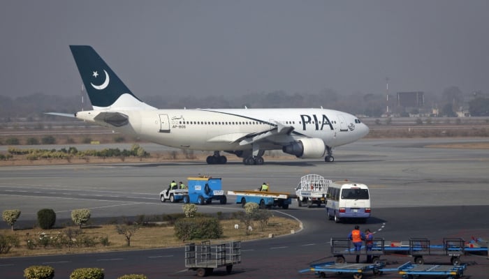 A Pakistan International Airlines (PIA) plane prepares to take-off at Alama Iqbal International Airport in Lahore February 1, 2012. — Reuters