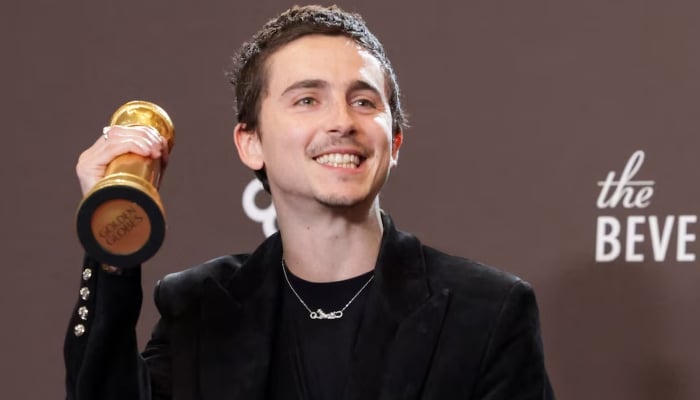 Timothee Chalamet poses with the Best Performance by a Male Actor in a Motion Picture - Musical or Comedy award for Marty Supreme at the 83rd Annual Golden Globes in Beverly Hills, California, US, January 11, 2026. — Reuters