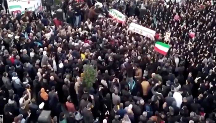 Mourners carry coffins during a funeral procession for members of security forces and civilians said to be killed in protests on Sunday in Tehran, Iran, in this screengrab from a video released on January 11, 2026. — Reuters