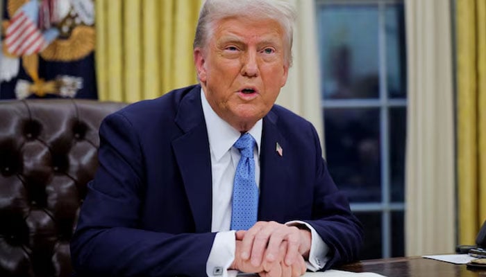 US President Donald Trump looks on as he signs an executive order in the Oval Office at the White House in Washington, US, January 31, 2025. — Reuters