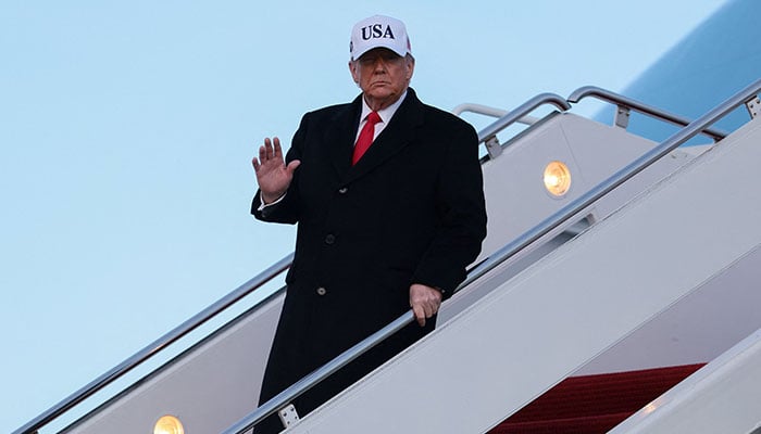 US President Donald Trump disembarks Air Force One, on his return from Detroit, Michigan, at Joint Base Andrews, Maryland, US, January 13, 2026. —  Reuters