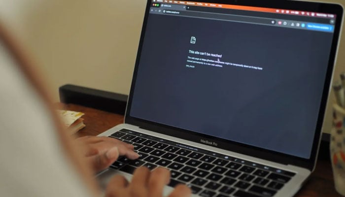 A woman tries to access internet in Karachi on March 6, 2024. — Reuters