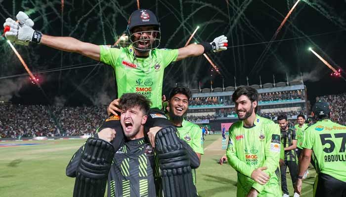Lahore Qalandars players and support staff celebrate winning the PSL 10 title after beating Quetta Gladiators at the Gaddafi Stadium in Lahore on May 25, 2025. — PCB