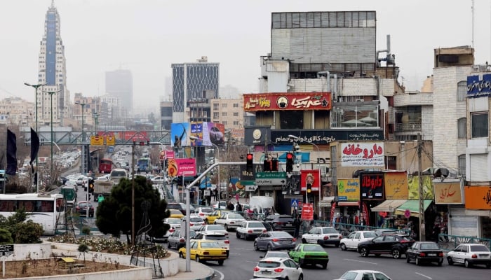 Commuters drive along a street in Tehran, Iran, January 15, 2026. — AFP
