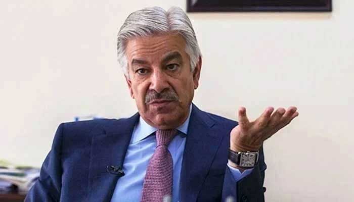 Defence Minister Khawaja Asif gestures during an interview. — Reuters/File
