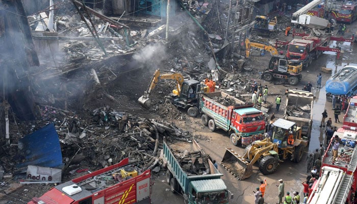 The image shows search and rescue operations in progress after a fire broke out at a shopping mall in the historic downtown district of the in provincial capital, Karachi, on January 19, 2026. — Online