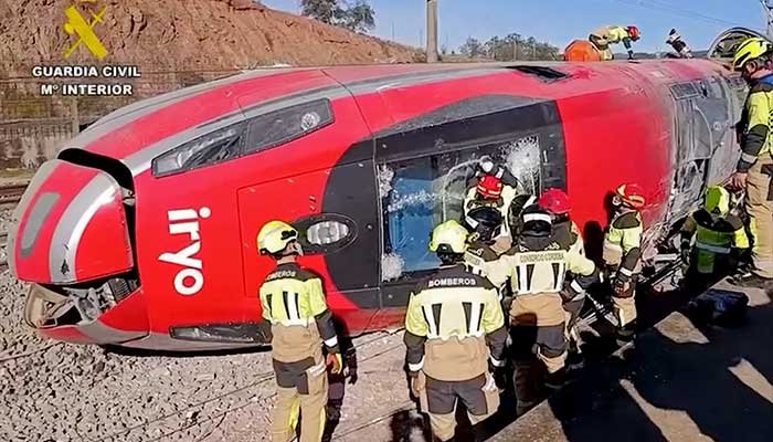 In this still image from video taken and released on January 19, 2026 by the Spains Guardia Civil, emergency workers are seen at the site where a high-speed Iryo train derailed and was hit by another train as rescue efforts continue in Adamuz, southern Spain, on January 19, 2026. — AFP