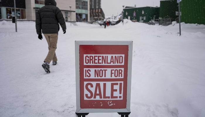A large sale-style sign reading Greenland is not for sale is pictured outside of a clothing shop in Nuuk, Greenland, on January 19, 2026. — AFP