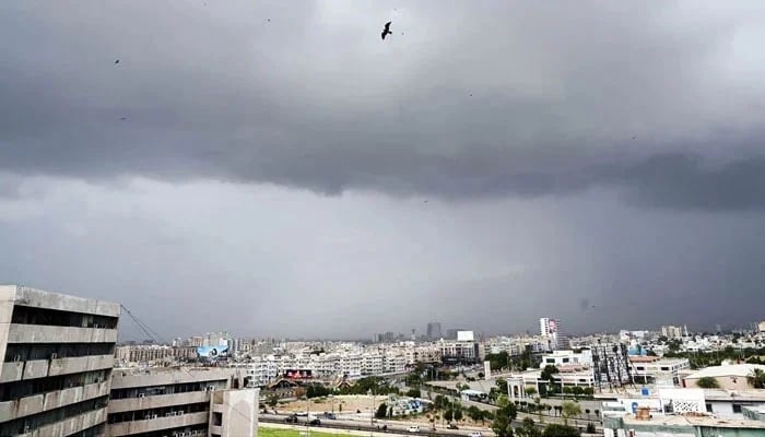 Nimbostratus clouds cover the sky in a dark gray layer over the metropolis, heralding the imminent arrival of rain in Karachi on July 19, 2024. — APP