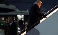 Why did Trump's plane return mid-flight en route to Davos?